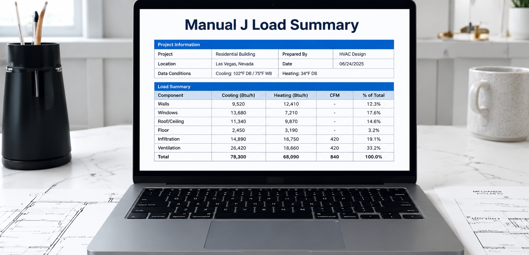Engineering load calculation spreadsheet on laptop